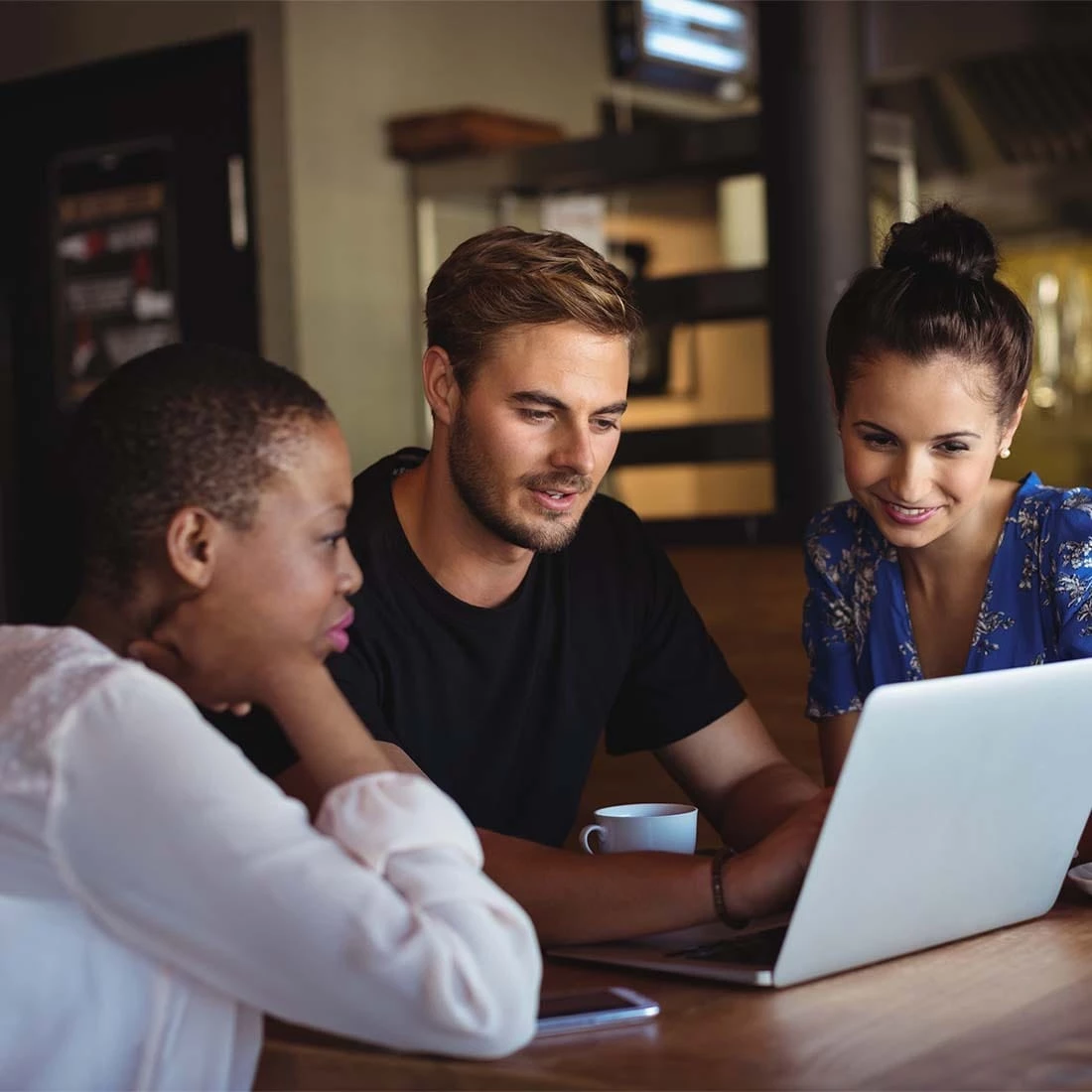 People looking at a computer